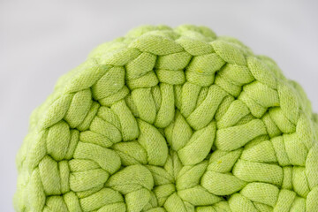 bottom of cute crocheted light green basket, stuff organizer, crochet baskets bottom, pattern for crocheting, nature-friendly sustainable handicraft business, cute interior items. Space for your text