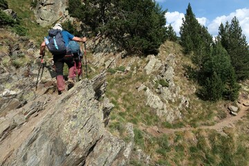 Fototapeta premium A long day of summer hiking in the Pyrenees with a bit of a scramble in the end. The summit is called Pica d'Estats.