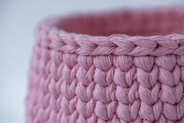 crocheted pink basket, stuff organizer, crochet baskets side, pattern for crocheting, nature-friendly sustainable handicraft business, cute interior items. Space for your text