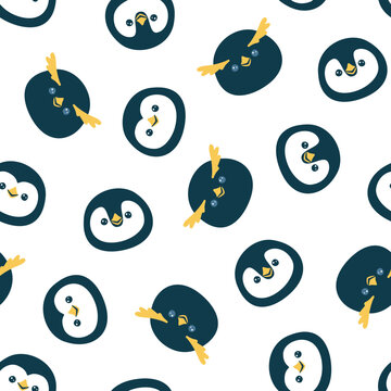 Vector seamless pattern with cute penguin faces