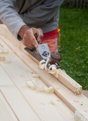 Working with hand plane. Joiner's (carpenter's) tool.