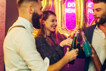 Multiracial people celebrating a party, new year's eve or birthday in the club