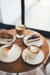 Desserts and coffee on wooden table.
