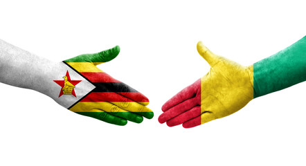 Handshake between Guinea and Zimbabwe flags painted on hands, isolated transparent image.