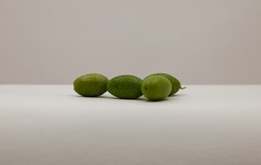Large green olives are isolated background.