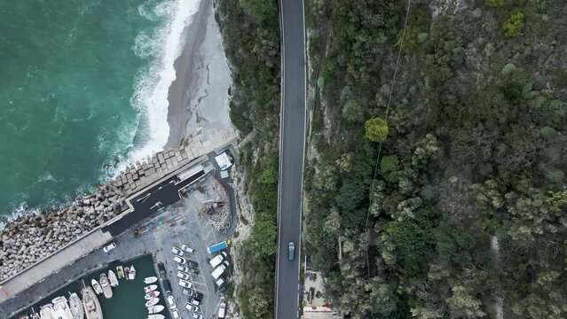 Aerial view of vehicles driving on the road in Cetara Amalfi Coast, Salerno, Campania, Italy.