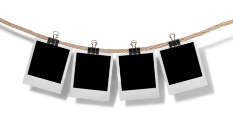 Hanging instant photo frames on brick wall background