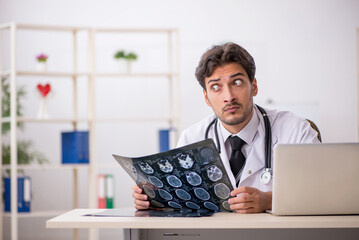 Young male doctor radiologist working in the clinic