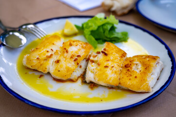 Grilled fillet of white codfish served in fish restaurant in San Sebastian, Basque Country, Spain