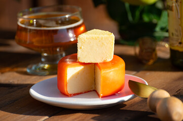 Food and drink pairing, apple cider produced on organic farm from bio apples in Normandy, France and cheddar cheese from England