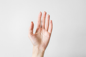 Woman's hand on white background