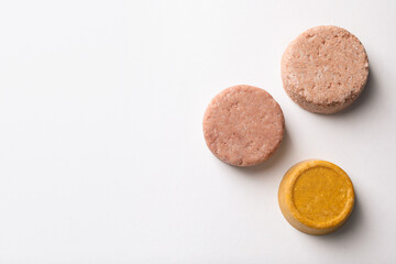 Solid shampoo bars on white background, flat lay. Space for text