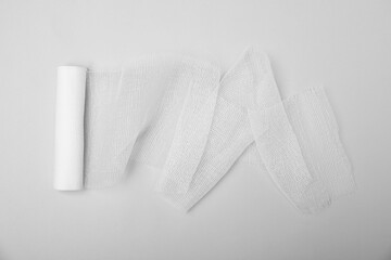 Medical bandage on white background, top view