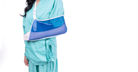 Injured asian woman wear patient broken wrist arm hand with splint soft with copy space on white background.Injury female orthopedic broken arm splint hand accident over isolated.Advertising Insurance - obrazy, fototapety, plakaty