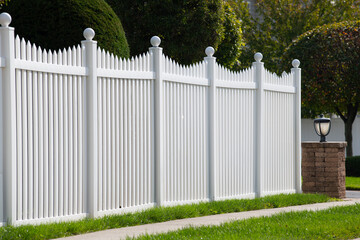 White vinyl fence in residential neighborhood