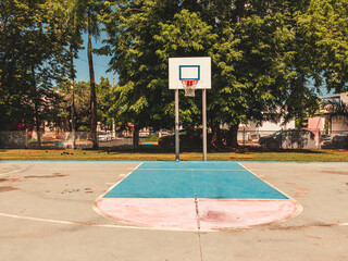 Simple street urban basketball court portrait from "parque la merced" puerto rico in the evening.