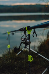 Sunrise or sunset fishing. Fishing rods on the background of the lake. Sports fishing. selective focus