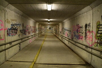 City underground tunnel with graffitis
