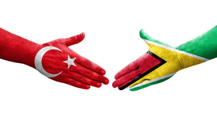 Handshake between Guyana and Turkey flags painted on hands, isolated transparent image.