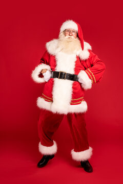 Merry Christmas and Happy New Year! Full length photo of Santa Claus with white beard looking at the camera. Xmas sale, discount concept.