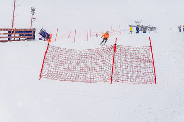 Winter, snowy day. Ski slope, practice slide, safety net for beginner skiers