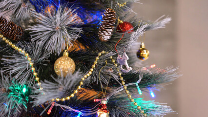 New Year fir tree with decorations and illumination. Christmas tree decorations