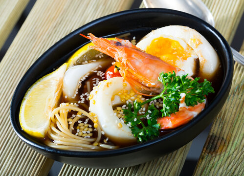 Spicy pan-Asian soup boiled with squid, shrimp, egg noodles and sesame