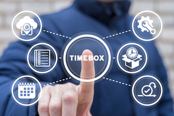 Man using virtual touchscreen presses inscription: TIMEBOX. Timeboxing. Timebox - time interval for...