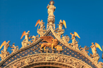 Fototapeta premium St Mark Basilica facade detail, with lion and angels, Venice, Italy