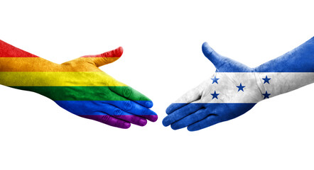 Fototapeta premium Handshake between Honduras and LGBT flags painted on hands, isolated transparent image.