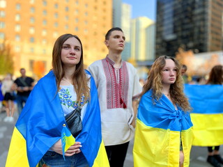 War of Ukraine and Russia crying children Three teenagers left Ukraine for Canada They are waiting for them to return home to their parents Freedom of Ukraine and terrorism in Russia Ukrainian flags