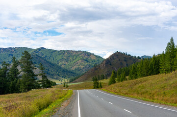 Fototapeta na wymiar A good asphalt road in the Altai highlands