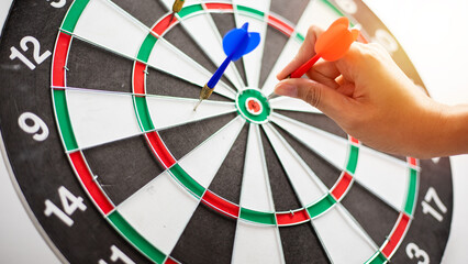 Hand business put a dart hit on the target,Goal target concept