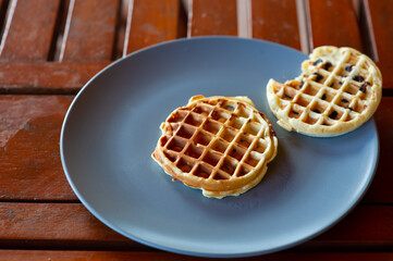 A type of Thai dessert made from flour, sugar and coconut milk. It's on a plate on the table.