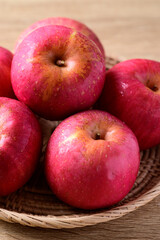 Red apple fruit in basket on wooden background, Healthy fruit