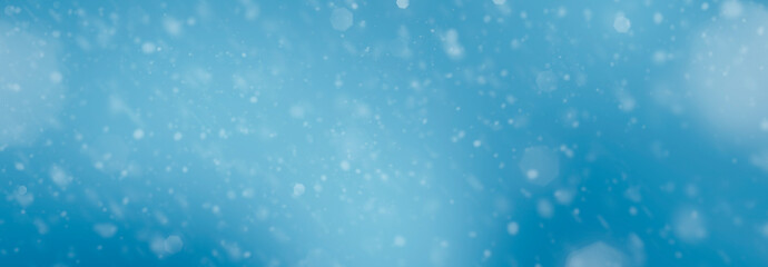 blue color blurred background with falling snow - for christmas use