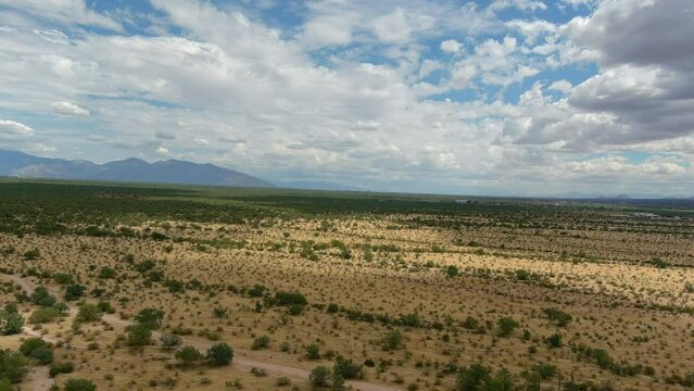 Wide aerial shot of the desolate Sonoran desert in Arizona, slow moving drone shot