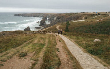 Hiking along the coast at the Bedruthan Steps, Cornwall, England. 