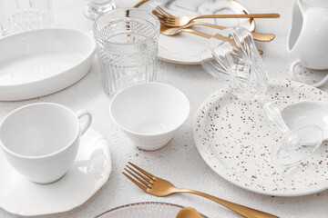 Fototapeta na wymiar Many different tableware on white background