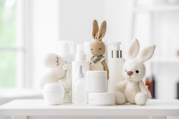 Different bath accessories for children and cute toys on table in light bathroom, closeup