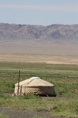 A ger (tent) and the desolate desert, Gobi Desert, Umnugovi province, Mongolia. In summer time, the surrounding desert is hot in the afternoon. And it is cold in the night. 