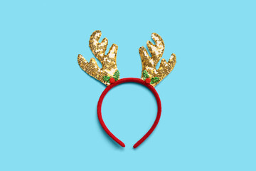 Funny Christmas reindeer horns on blue background