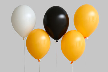 Halloween balloons on grey background