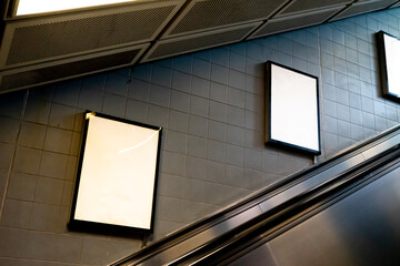 Blank billboard inside subway station