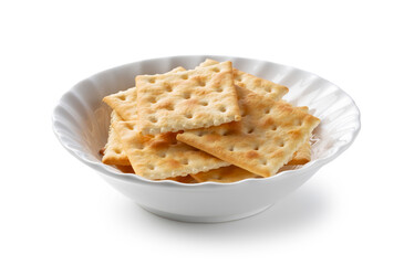 Crackers in a dish placed on a white background.