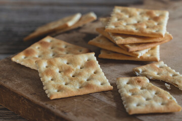Cracker placed against old wooden background.