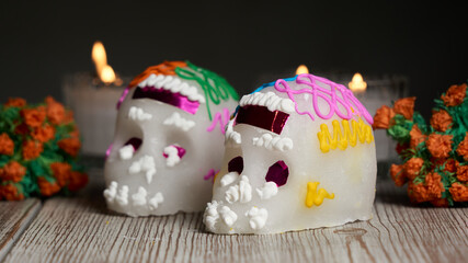 Fototapeta na wymiar Sugar skull with Candles, Decoration traditionally used in altars for the celebration of the day of the dead in Mexico