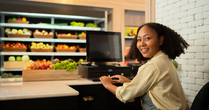 Portrait Of A Black African American Woman Working On Cashier In A Supermarket Or Retail Shop And Food On Grocery Products. Food Shopping. People Lifestyle. Checkout Business Counter Service. Worker