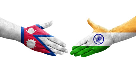 Handshake between India and Nepal flags painted on hands, isolated transparent image.