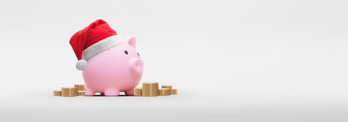 Pink piggy bank with santa claus hat on a white background - saving concept for christmas